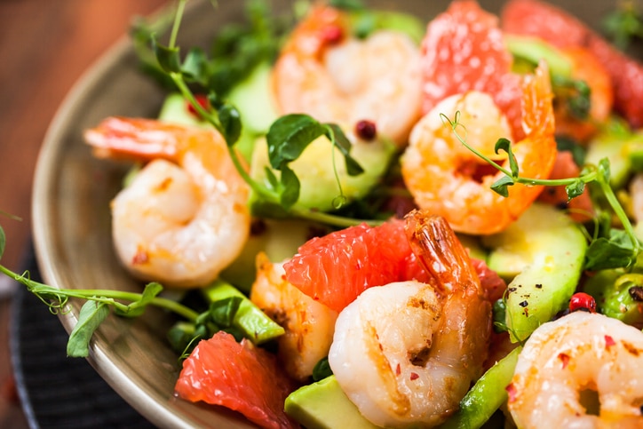 Delicious fresh salad with prawns, grapefruit, avocado, cucumber and herbs