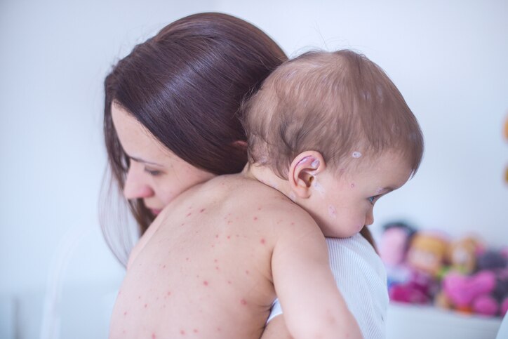 Mother nursing sick child At Home