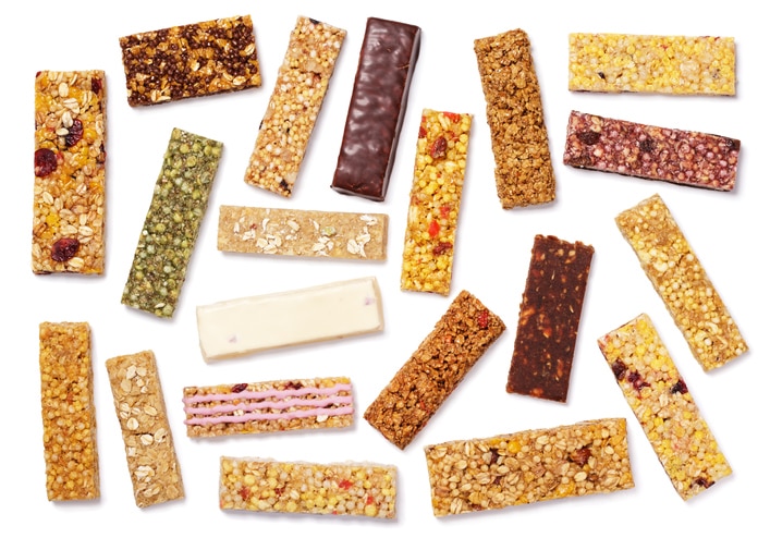 Top view of various healthy granola bars (muesli or cereal bar). Set of protein bar isolated on white background