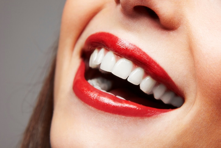 Red lips in a young woman.