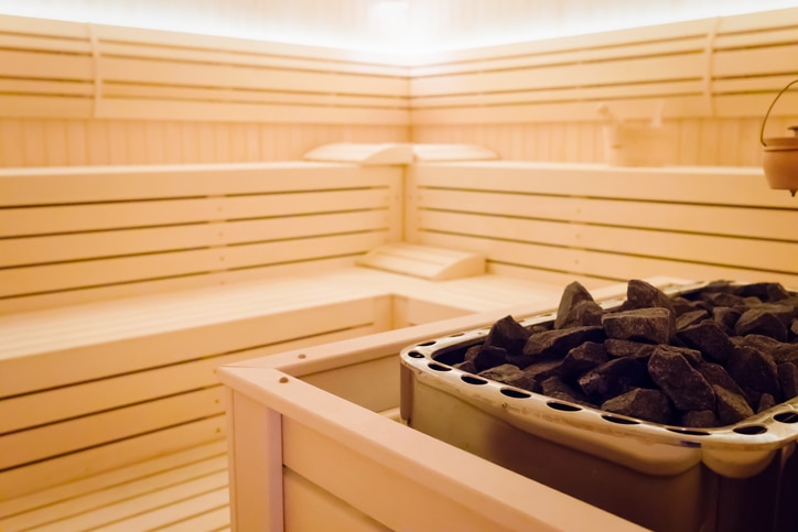 Beautiful sauna interior with heater  and stones