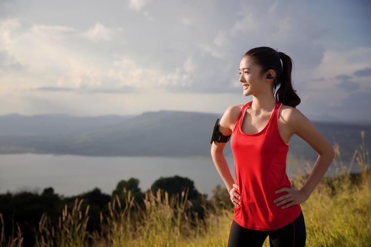 Asian women are relaxing out of the running exercise. She is looking sun