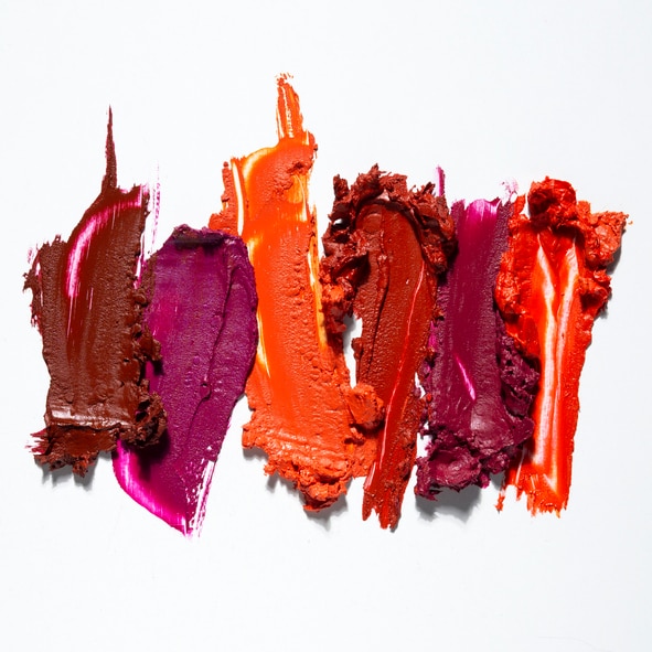 Creative concept photo of cosmetics swatches on white background.