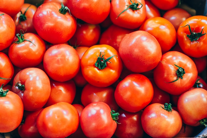 red tomatoes texture overhead. background vegetables