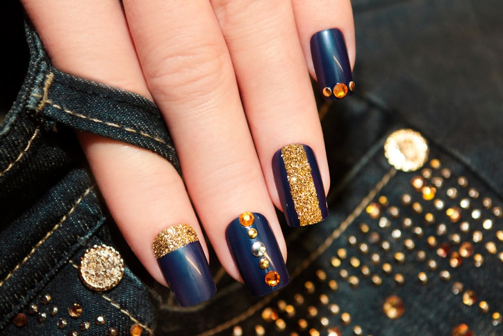 Denim blue manicure with rhinestones and sequins.