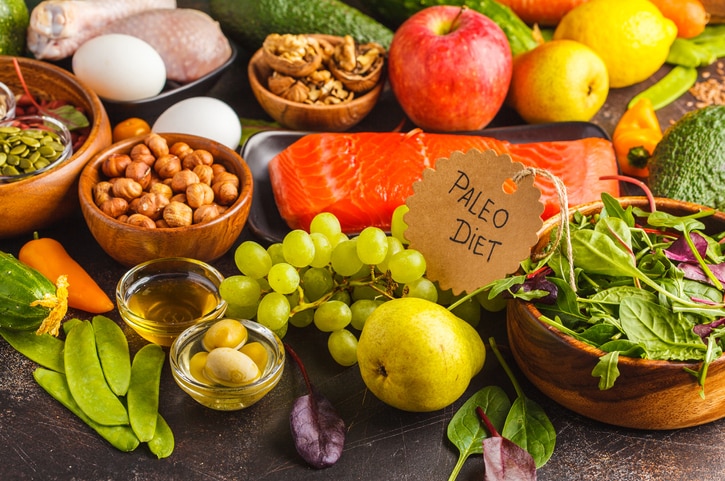 Paleo diet concept. Balanced food background on the table. Copy space, dark background.