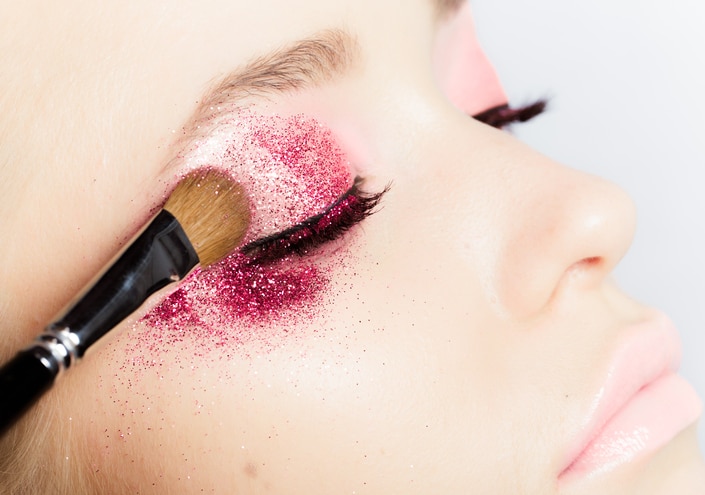 Woman applying eyeshadow, beauty make-up