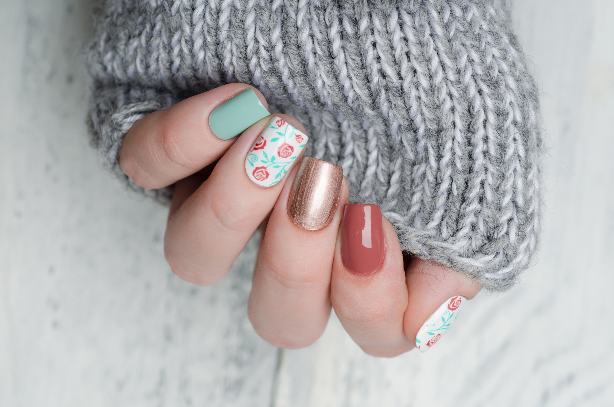 pink blue and gold manicure with floral print