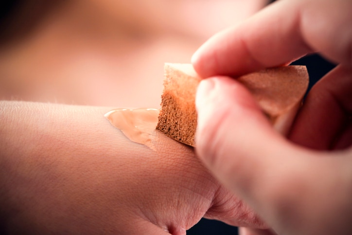 Applying moisturizer on hand